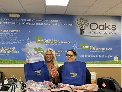 Two volunteers with backpacks